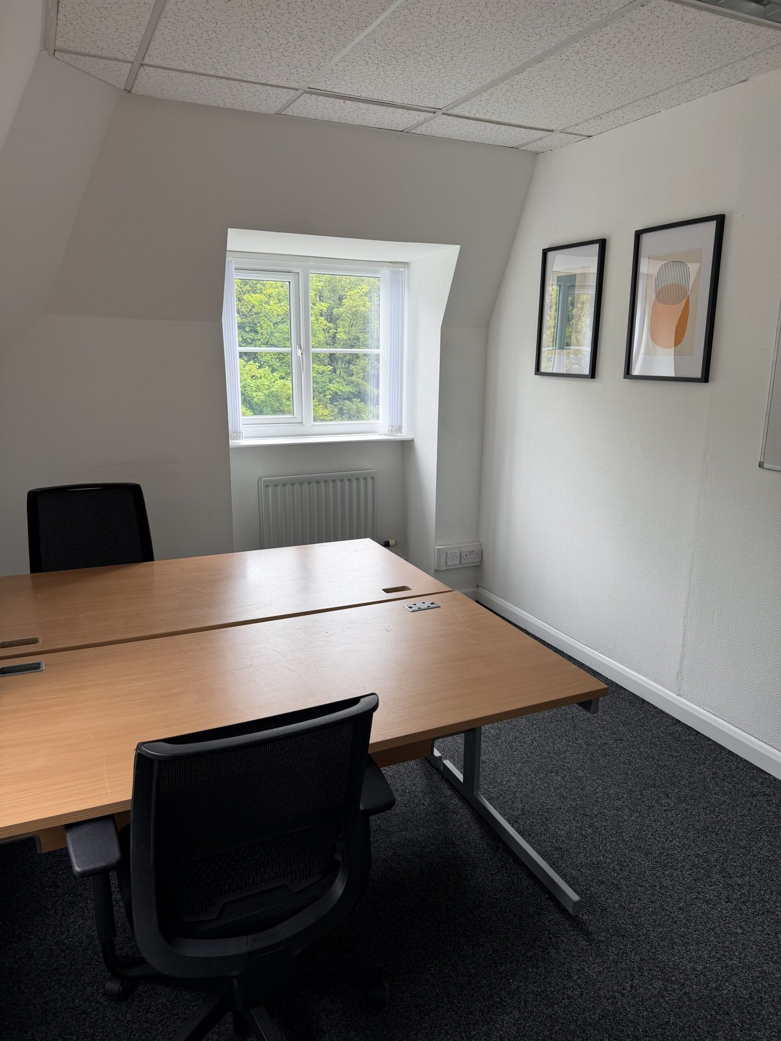 Bright, modern office with two desks in a coworking space in the Wirral